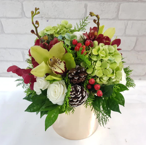 Green and red flower arrangement for Christmas
