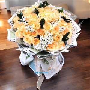 Creamy yellow roses mixed with white baby's breath