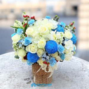 Basket of fresh flowers as a gift for a male boss