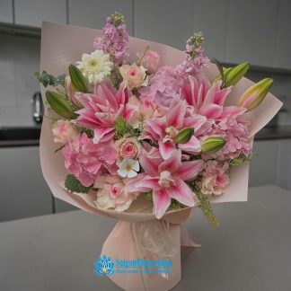 Bouquet of pink lilies as a birthday gift for Mom