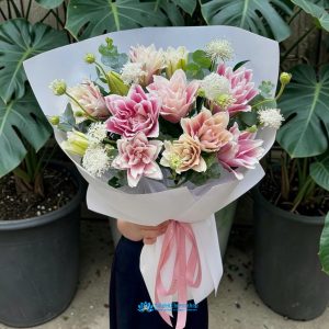 Bouquet of pink lilies at a Saigonflowershop.
