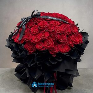Romantic red roses wrapped in black paper